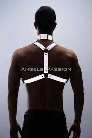 Silver reflective body harness and choker set worn by a man