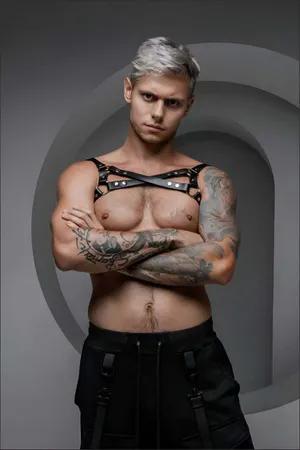 Black faux leather chest harness with O-rings and adjustable straps