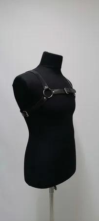 Black faux leather strappy chest harness with O-ring and buckle
