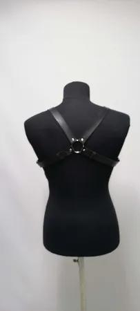 Black faux leather strappy chest harness with O-ring and buckle