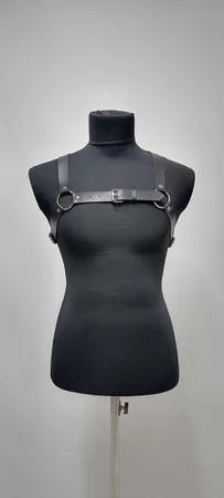 Black faux leather strappy chest harness with O-ring and buckle