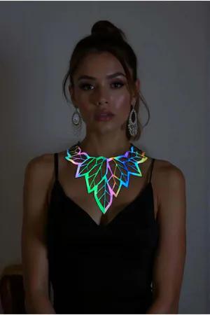 Rainbow iridescent leaf choker necklace on a woman, reflective material