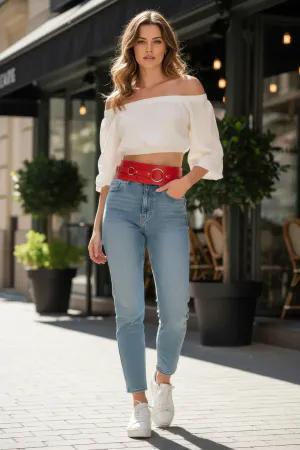 Red Faux Leather Wide Waist Belt with Triple Silver O-Rings over a white top and blue jeans
