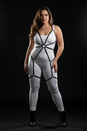 Black adjustable full body harness with O-ring detail worn by a plus size model.