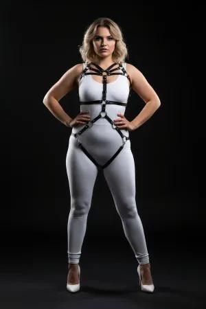 Black faux leather full body harness with O-ring details and adjustable straps on a plus-size model.