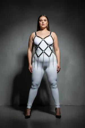 Black faux leather full body harness with diamond lattice and silver chain fringe, worn by a plus-size model
