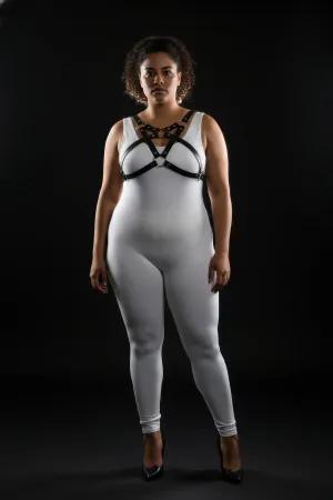 Black vegan leather chest harness with O-ring detail worn by a plus-size model
