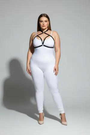 Black faux leather strappy chest harness with O-ring detail worn by a plus-size model