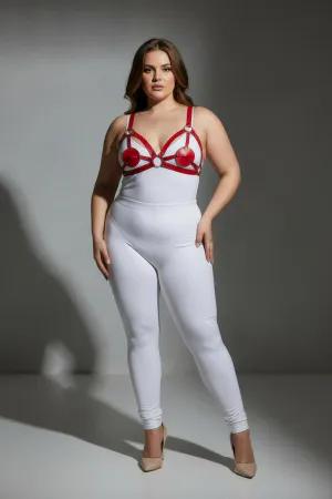 Red faux leather strappy harness with heart details and silver rings worn by a plus-size model