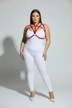 Red faux leather strappy chest harness with O-ring detail worn by a plus-size model