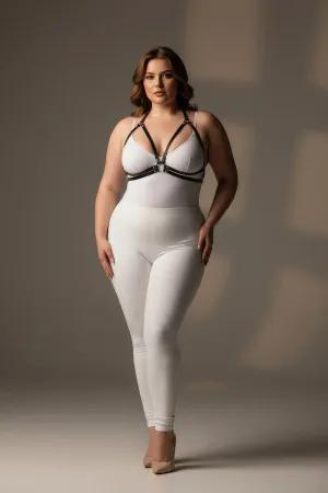 Black minimalist faux leather chest harness with central O-ring and adjustable straps worn by a plus-size model.