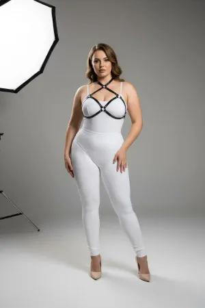 Black faux leather strappy chest harness with O-ring details, worn by a plus-size model.