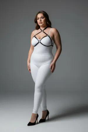 Black faux leather strappy chest harness with O-ring details, worn by a plus-size model.