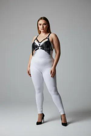 Black faux leather fringe body harness with central O-ring worn by a plus-size model.