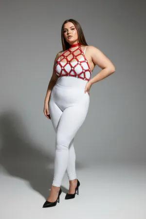 Red geometric cage halter harness with nail details worn by a plus-size model