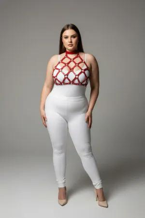 Red geometric cage halter harness with nail details worn by a plus-size model