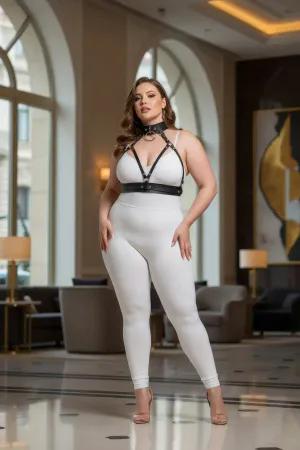 Black faux leather choker and chest harness set with O-ring detail on a plus size model