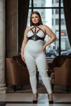 Black faux leather body harness with high collar and adjustable straps, worn by a plus-size model.