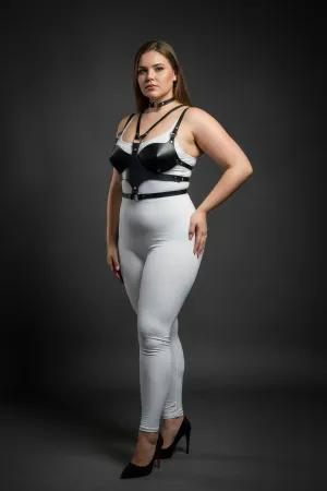 Black faux leather chest harness with choker set, worn by a plus-size model.