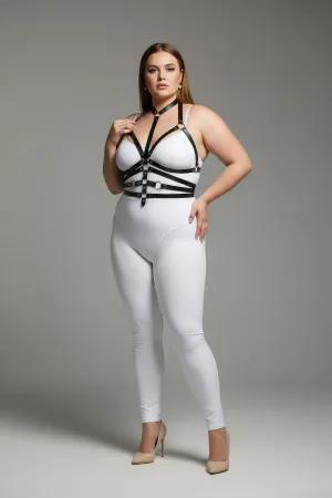 Black faux leather body harness with O-ring detail and adjustable straps worn by a plus-size model.