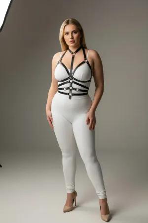 Black faux leather body harness with O-ring detail and adjustable straps worn by a plus-size model.