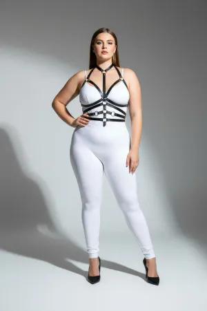 Black faux leather body harness with O-ring detail and adjustable straps worn by a plus-size model.