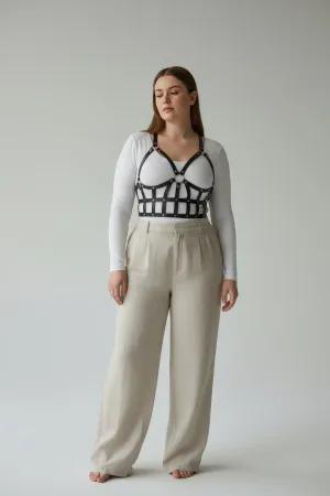 Black Caged Faux Leather Body Harness with Studded Grid Design worn over a white t-shirt