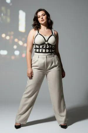 Black Caged Faux Leather Body Harness with Studded Grid Design worn over a white t-shirt
