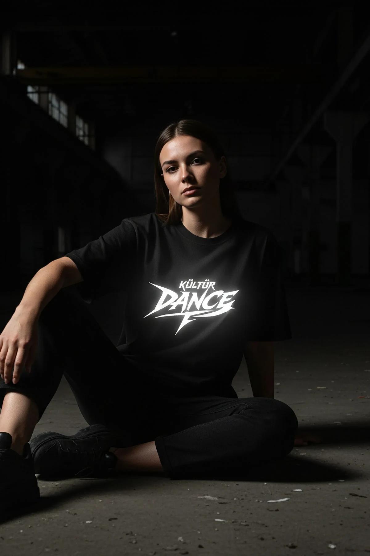 black oversized graphic t-shirt with white reflective Kültür Dance angular print on chest