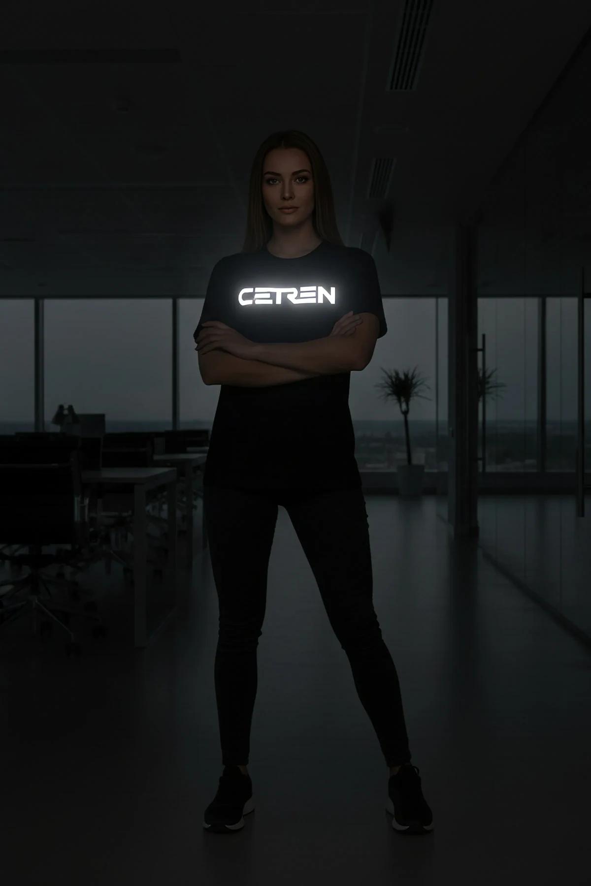 black reflective graphic t-shirt with glowing Yeditepe Dance Club chest print photographed in low light