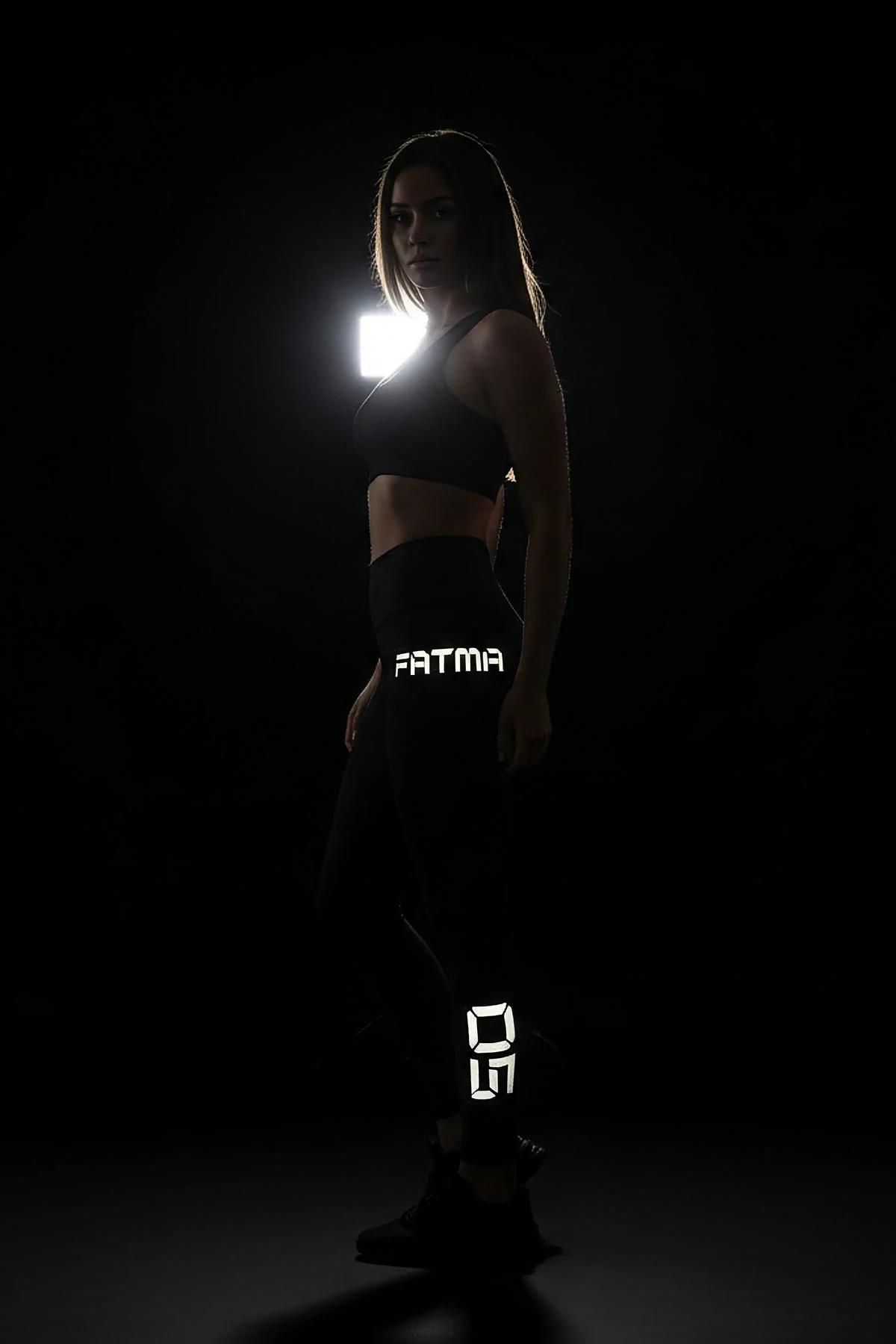 Black reflective body harness and choker set with silver O-ring hardware and light-catching strappy strap design