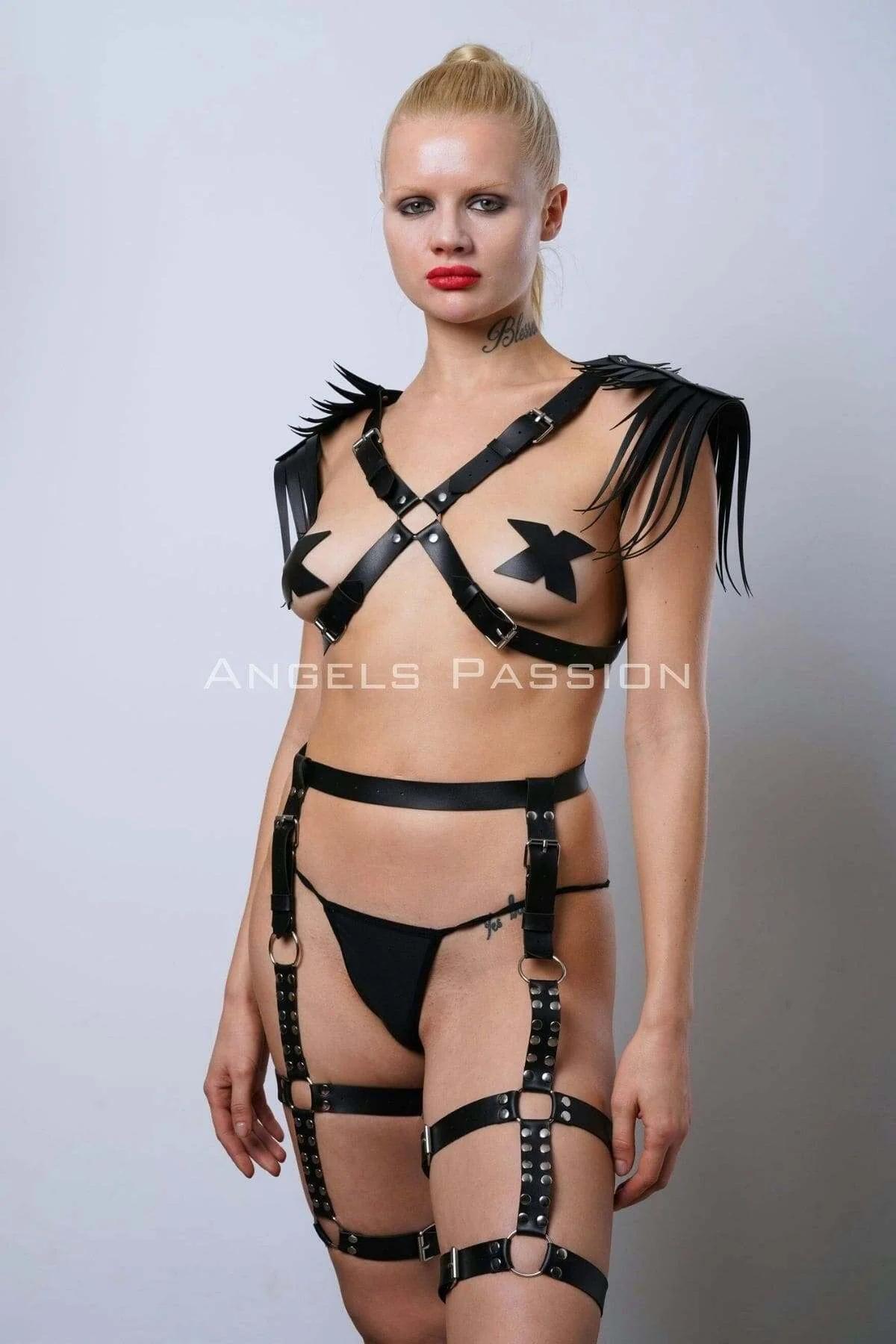 Black faux leather full body harness with fringe shoulder epaulettes and thigh garter cage straps