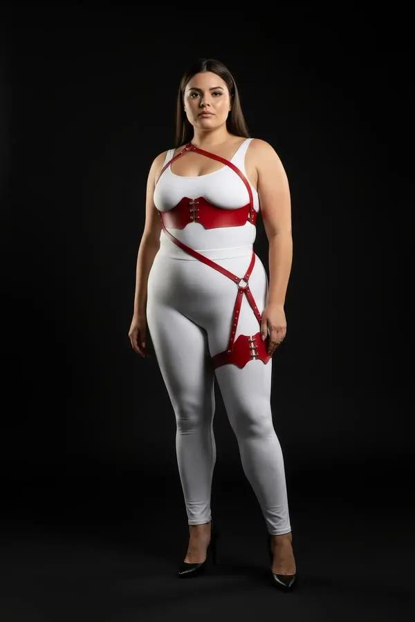 red faux leather strappy body harness with underbust band, diagonal O-ring hip strap, and scallop-edged thigh cuff, silver ha
