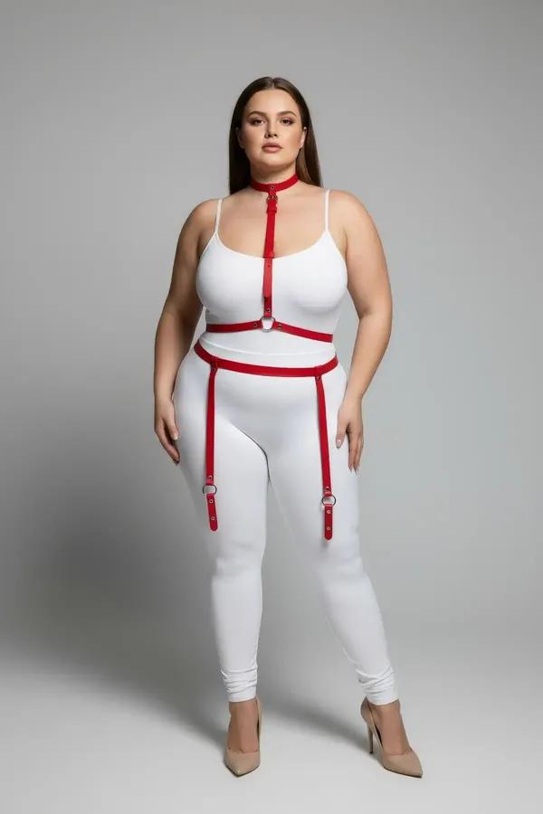 red vegan leather full body harness with gold O-ring chest detail and adjustable silver D-ring garter straps on plus-size mod