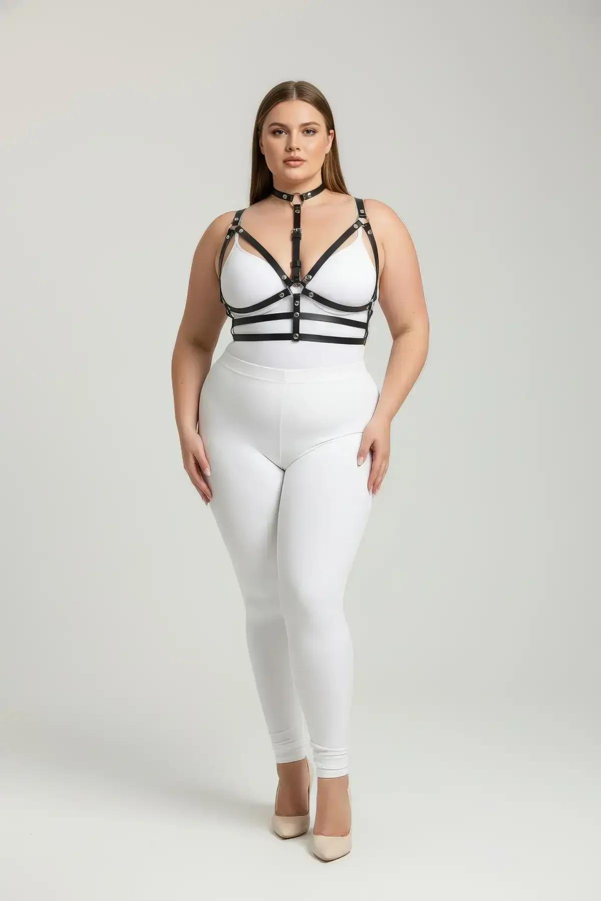 black faux leather strappy choker harness bra with silver O-ring center and multi-strap underbust bands worn on plus-size mod