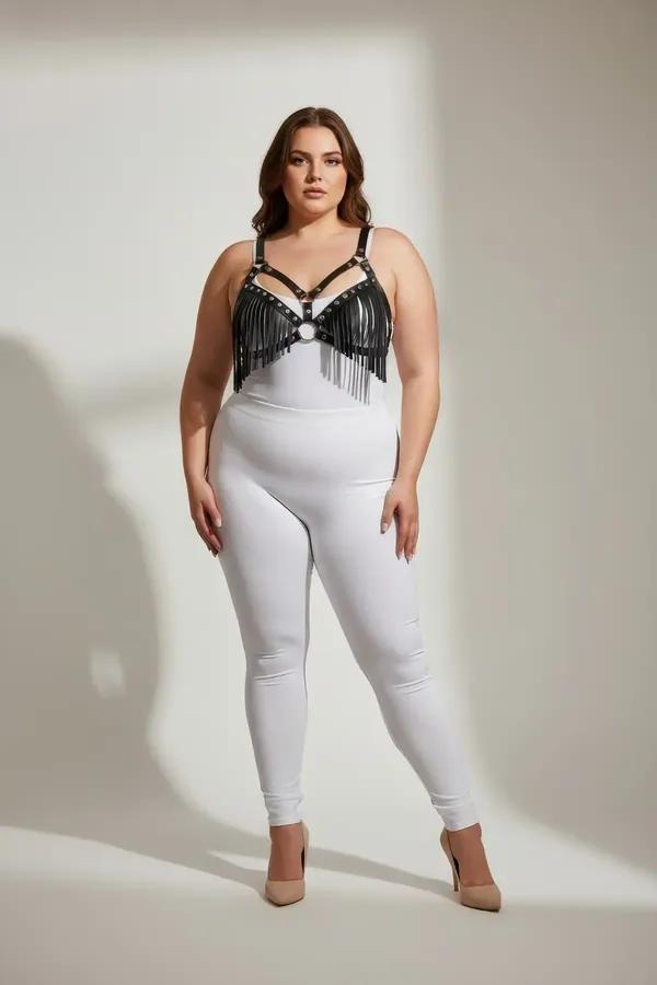 black faux leather fringe harness bra with silver O-ring and eyelet studs worn by plus-size model