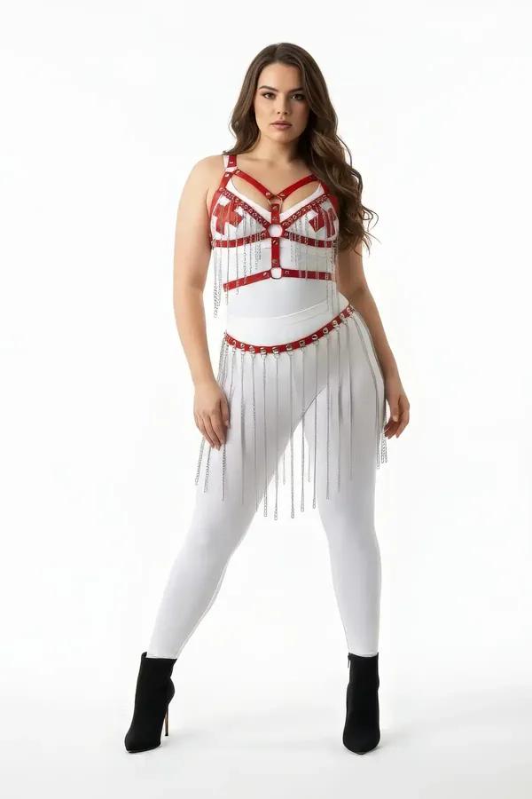 White faux leather body harness set with red bust accent straps and silver chain fringe skirt belt worn over white leggings