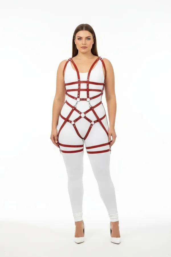 Claret red full body harness with silver O-rings and double thigh straps worn over white bodysuit, front view
