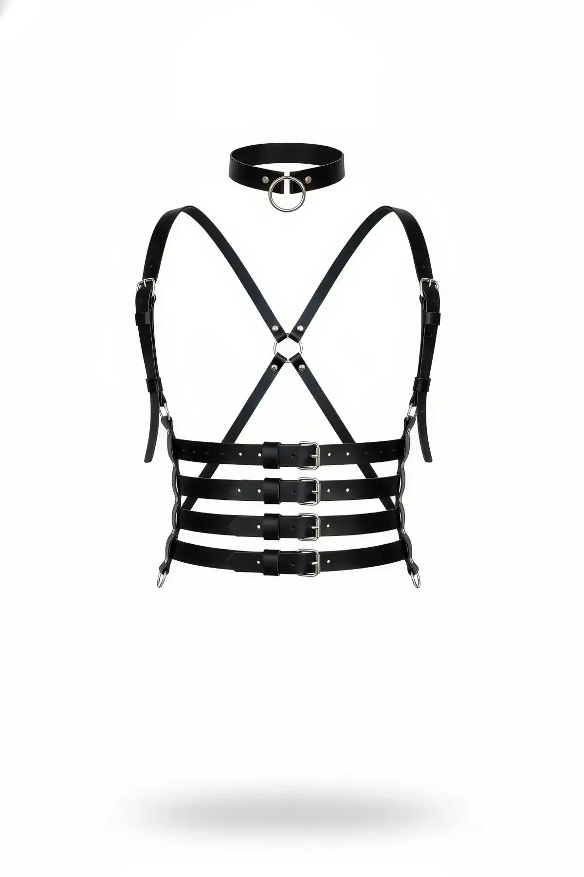 Black vegan leather multi-strap chest harness with three buckled waist bands and matching O-ring choker, flat lay on white ba