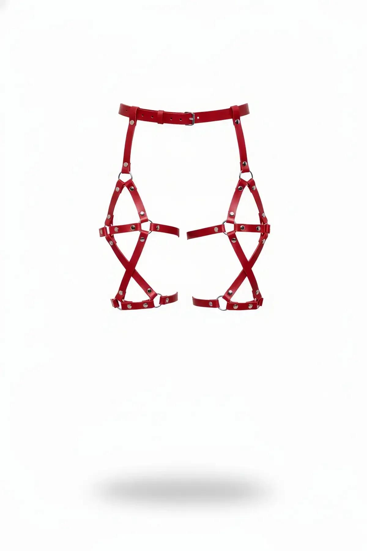 Red faux leather thigh harness with X-cross caged straps and adjustable silver pin-buckle waist belt, front view on white bac