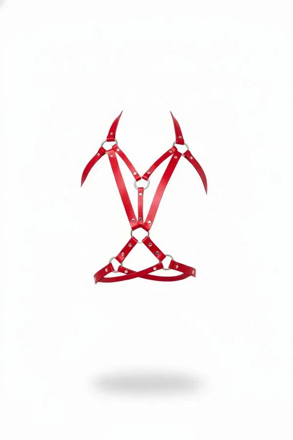 Red faux leather chest harness with three silver O-rings and geometric strap configuration on white background