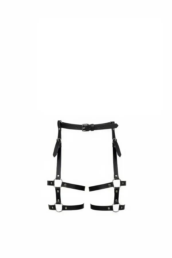 black faux leather thigh harness with silver O-rings and buckle waistband, front view flat lay