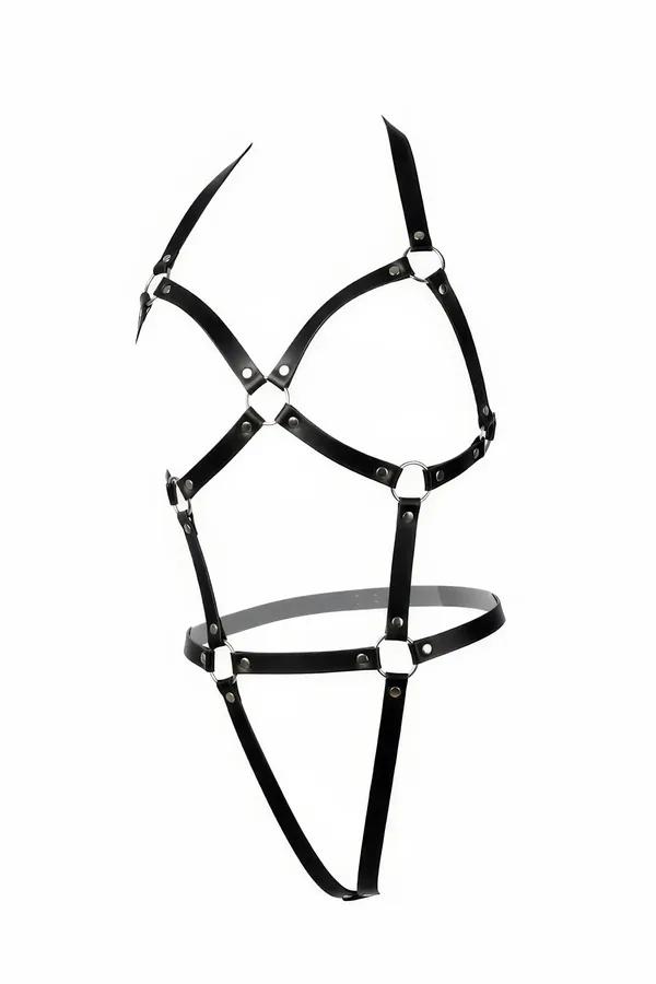 black faux leather body harness with silver O-rings at chest cross waist and hip junctions narrow 1 cm straps thong-style low
