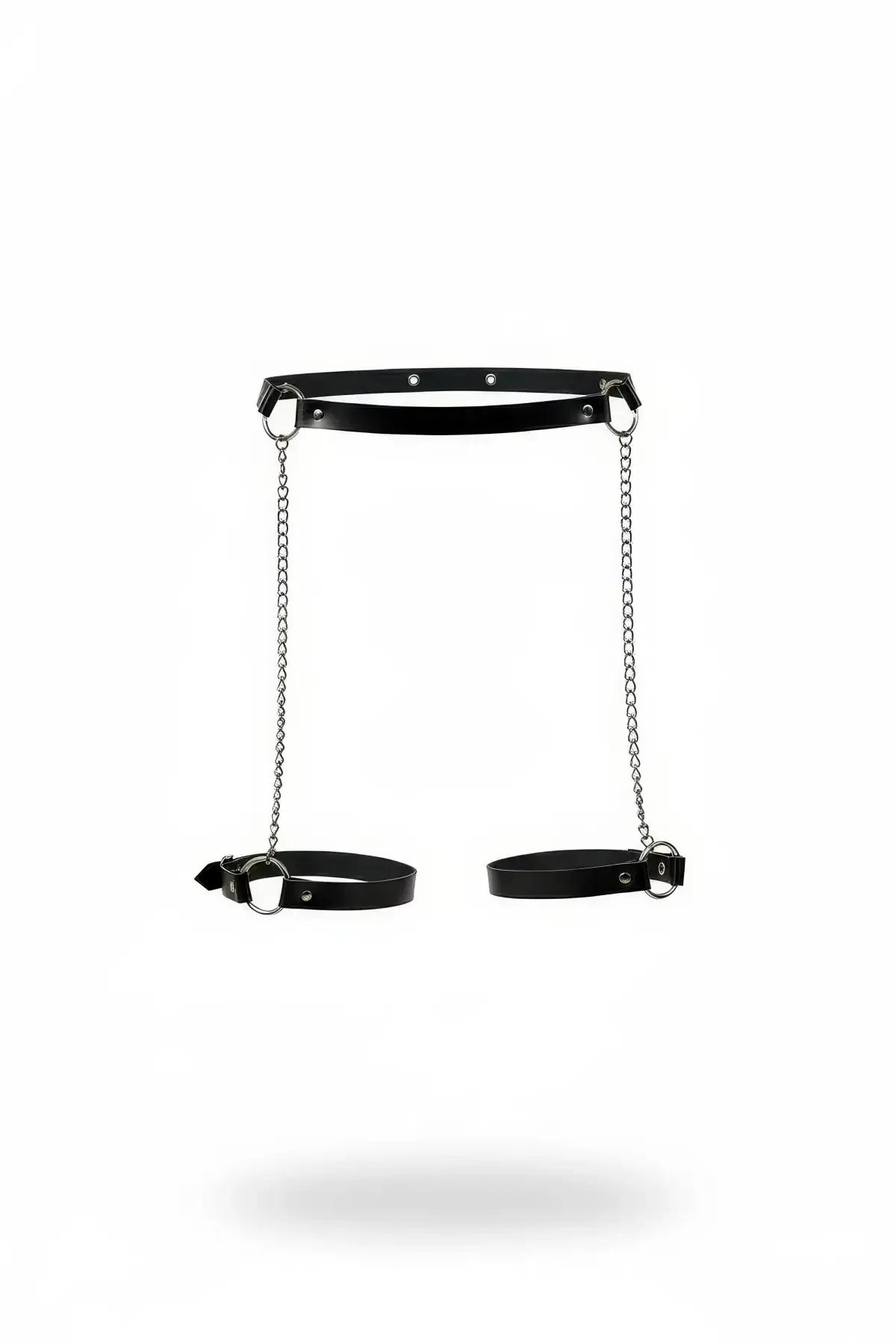 Black faux leather thigh harness with dual silver chains and adjustable leg garter bands, product flat lay