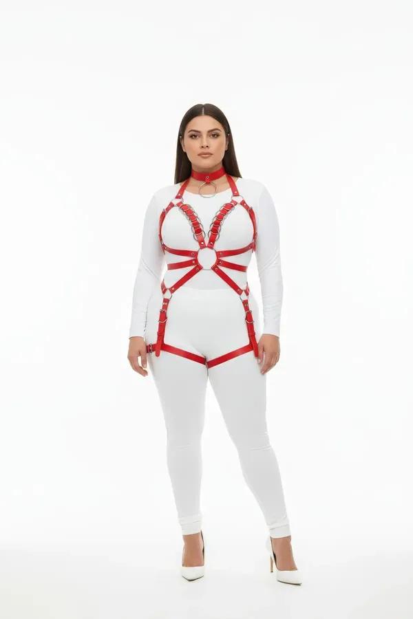 red faux leather full body harness with silver O-rings chest cage collar and hip straps worn over white bodysuit