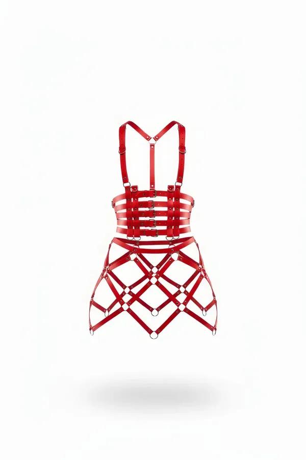 Red faux leather bustier top and cage skirt harness set with silver buckles and O-ring connectors on white background
