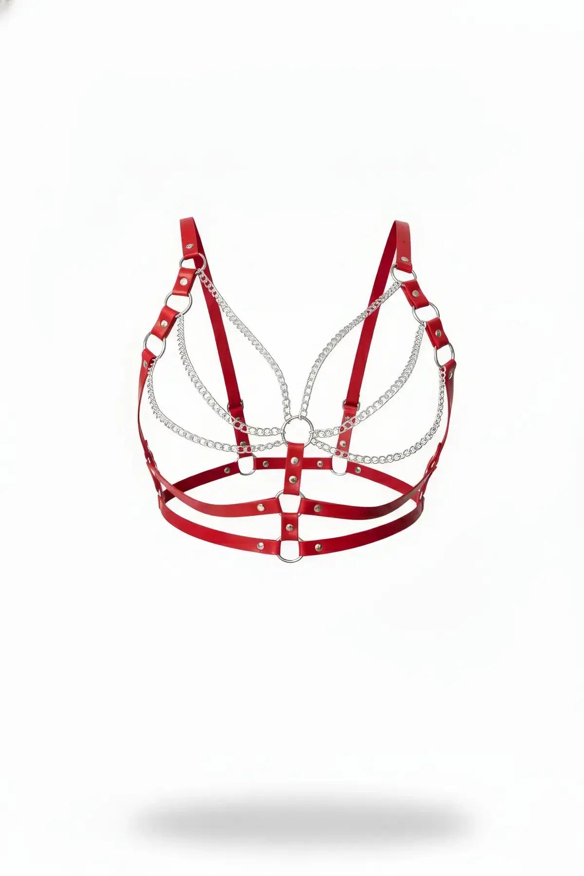 Red faux leather harness bra with cascading silver chain rows, O-rings, and adjustable straps on white background