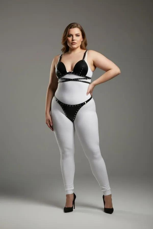 black faux leather studded bra top and thong harness set with silver eyelet trim on all straps and cup edges
