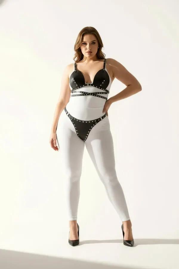 black faux leather studded bra top and thong harness set with silver eyelet trim on all straps and cup edges