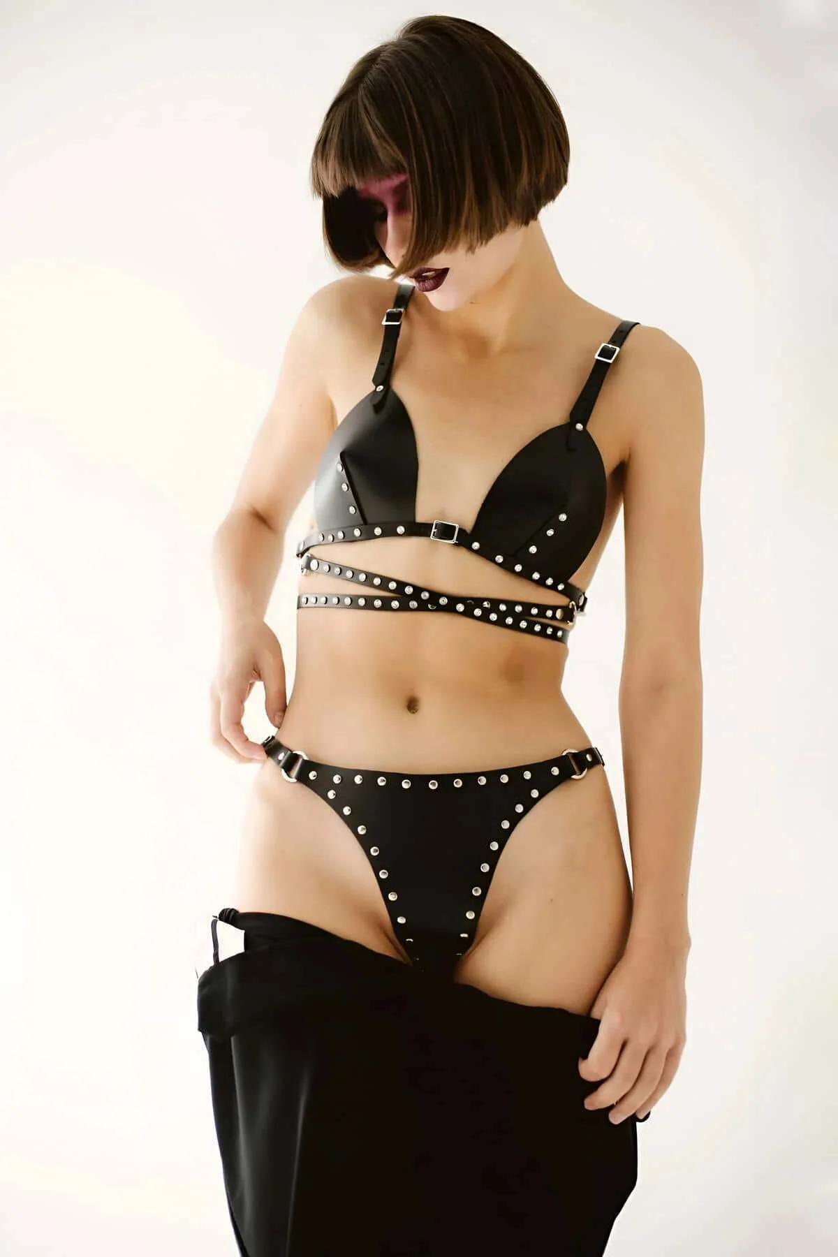 Black faux leather studded bra and thong harness set with silver dome studs and double midriff wrap straps